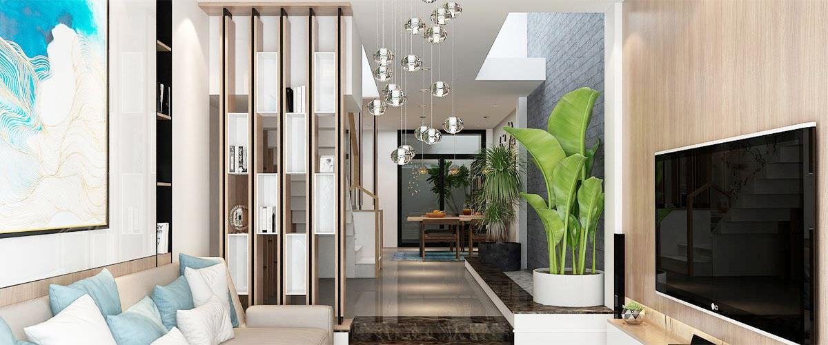 vách ngăn phòng khách và bếp có kệ trang trí